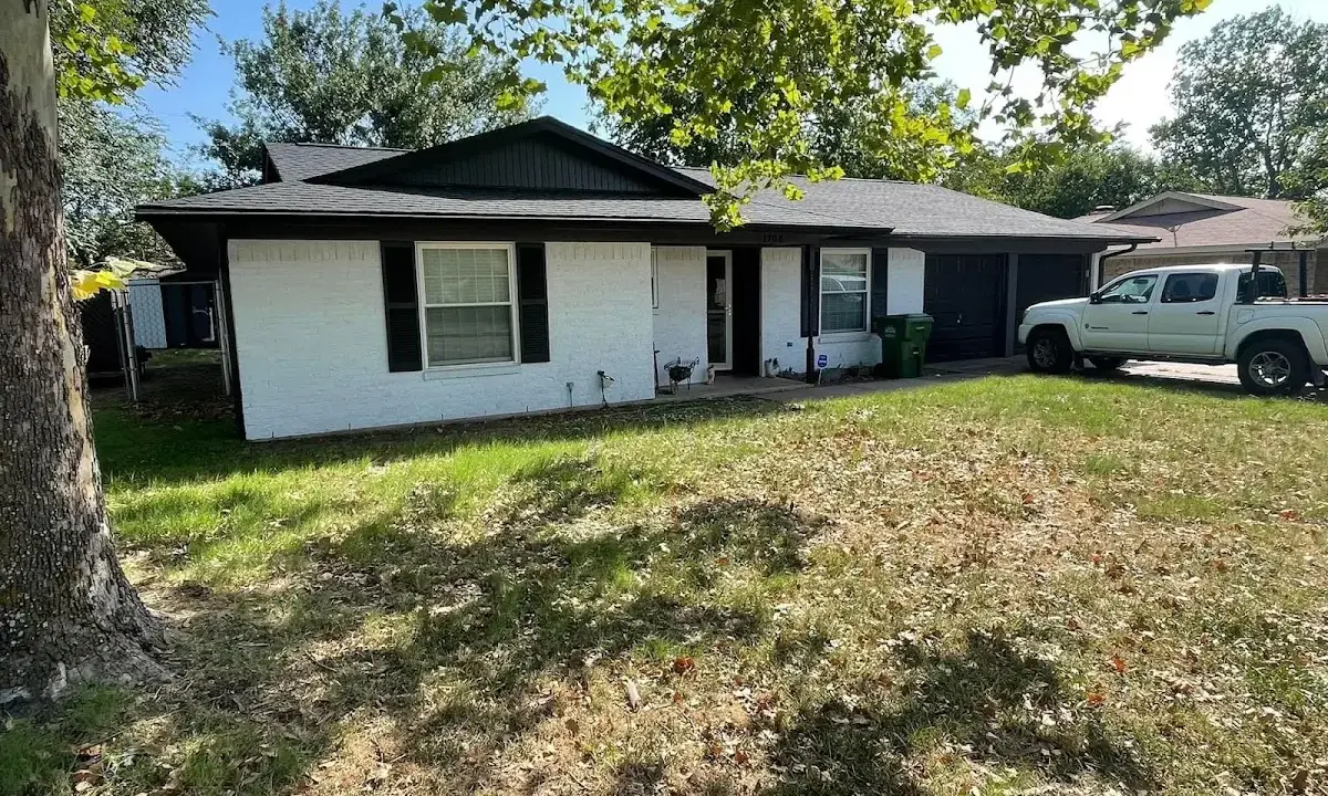 Professional roofing crew working on a residential roof in Wyldwood